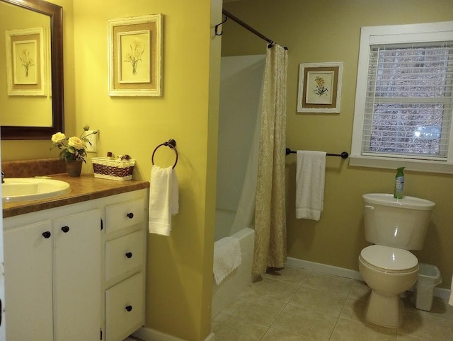 full bathroom with shower / bath combination with curtain, vanity, toilet, and tile patterned flooring