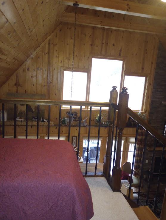 bedroom featuring wooden ceiling, lofted ceiling, and wood walls