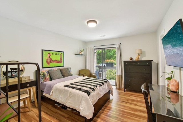 98 Dogwood Knob Ln Unit 3A, Sapphire, NC 28774 - bedroom featuring wood finished floors and access to exterior