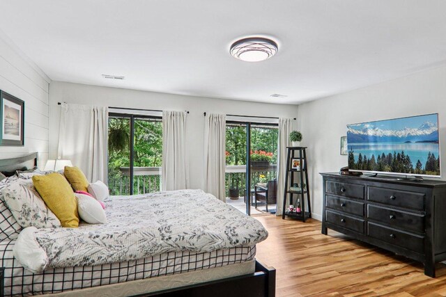 98 Dogwood Knob Ln Unit 3A, Sapphire, NC 28774 - bedroom with wood finished floors and access to exterior