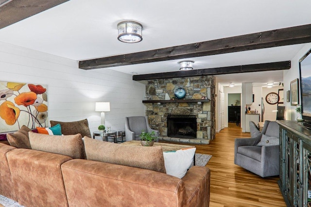 98 Dogwood Knob Ln Unit 3A, Sapphire, NC 28774 - living room with wood finished floors, beam ceiling, a fireplace, and wooden walls