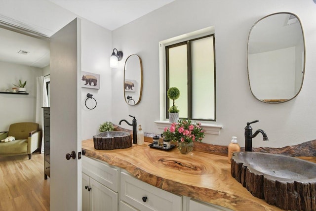 98 Dogwood Knob Ln Unit 3A, Sapphire, NC 28774 - bathroom with plenty of natural light, wood finished floors, and double vanity