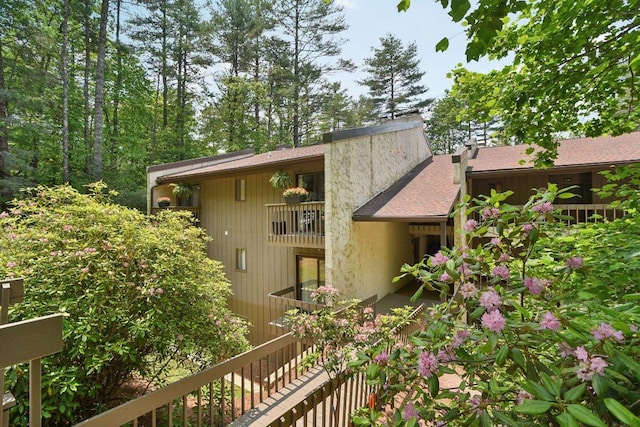 98 Dogwood Knob Ln Unit 3A, Sapphire, NC 28774 - view of home's exterior with a shingled roof and a balcony