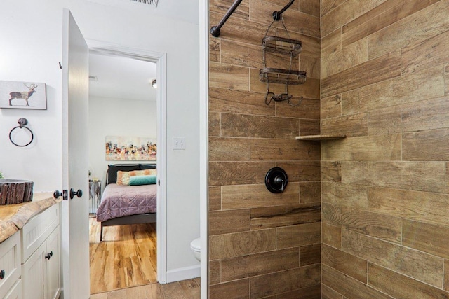 98 Dogwood Knob Ln Unit 3A, Sapphire, NC 28774 - full bath featuring vanity, ensuite bath, a tile shower, and wood finished floors