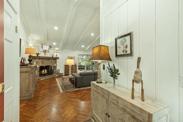 living room with beamed ceiling, recessed lighting, and a fireplace