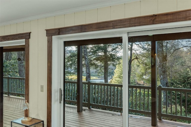 doorway featuring crown molding