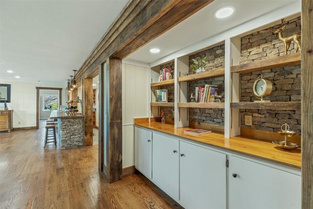 bar featuring wet bar and wood finished floors