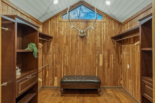 walk in closet featuring lofted ceiling and wood finished floors