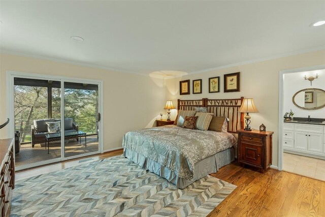 bedroom featuring access to exterior, connected bathroom, crown molding, baseboards, and light wood-style floors