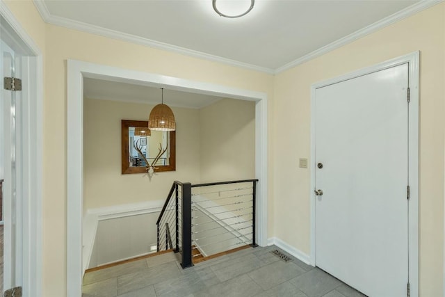 hallway featuring an upstairs landing and crown molding