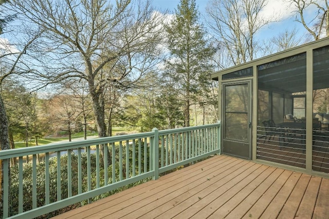 wooden deck featuring a sunroom