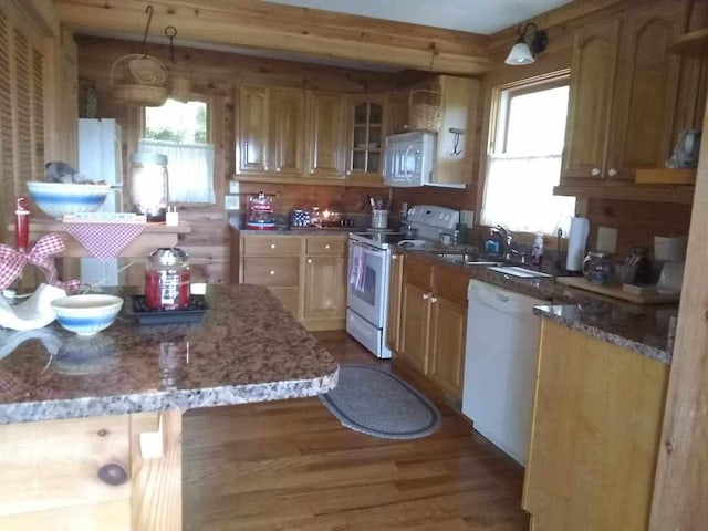 172 Moon Ridge Dr, Sky Valley, GA 30537 - kitchen featuring white appliances, wood finished floors, light stone countertops, glass insert cabinets, and a sink