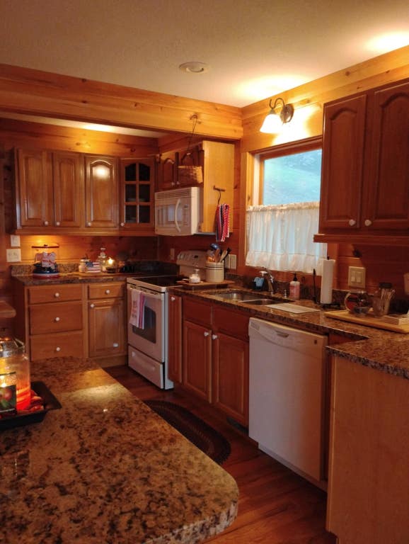 172 Moon Ridge Dr, Sky Valley, GA 30537 - kitchen with white appliances, a sink, dark wood finished floors, and stone countertops