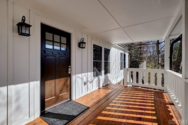 wooden terrace featuring a porch