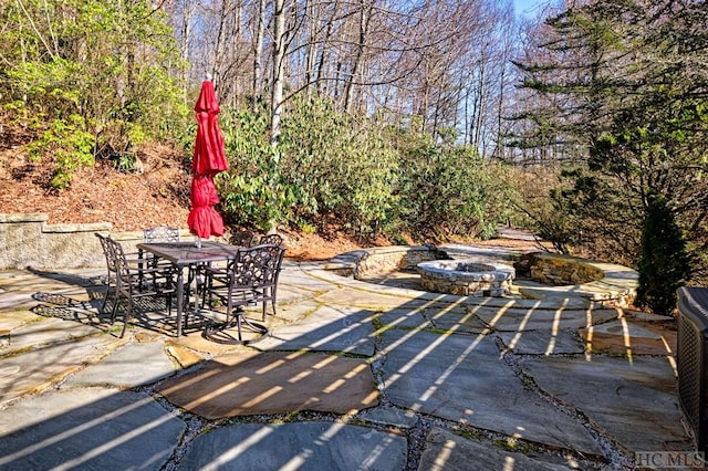 view of patio with a fire pit