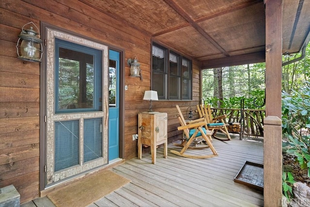 wooden deck featuring a porch