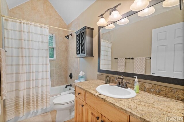 full bathroom featuring shower / bath combo, toilet, lofted ceiling, and vanity