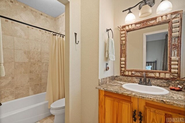 full bathroom with toilet, shower / bath combination with curtain, and vanity