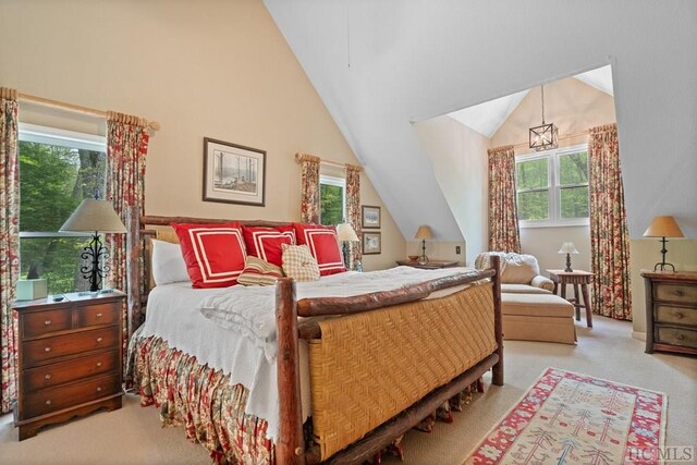 carpeted bedroom featuring vaulted ceiling