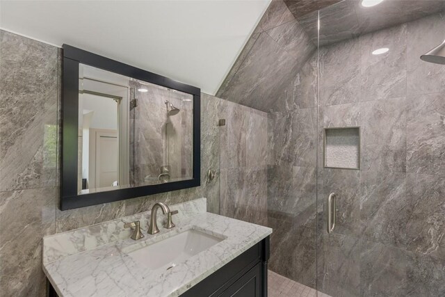 494 E Ridge Rd, Cashiers, NC 28717 - bathroom featuring a shower stall, vanity, and tile walls