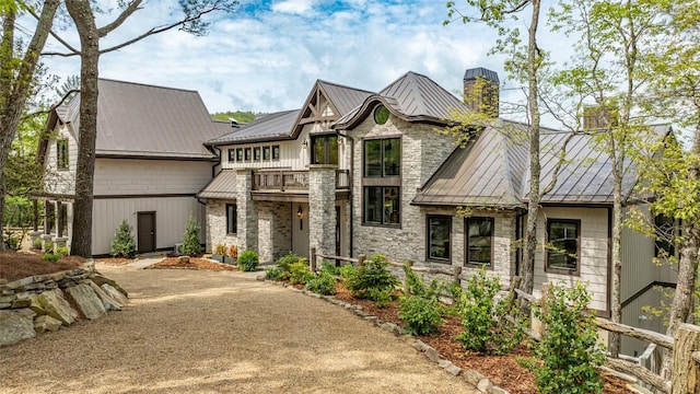494 E Ridge Rd, Cashiers, NC 28717 - view of front of home featuring a balcony, a standing seam roof, metal roof, and stone siding