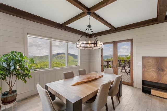 494 E Ridge Rd, Cashiers, NC 28717 - dining area with french doors, light wood-type flooring, beamed ceiling, wood walls, and coffered ceiling