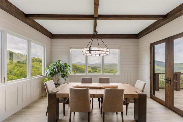 494 E Ridge Rd, Cashiers, NC 28717 - dining room with french doors, light wood-type flooring, beam ceiling, plenty of natural light, and a chandelier