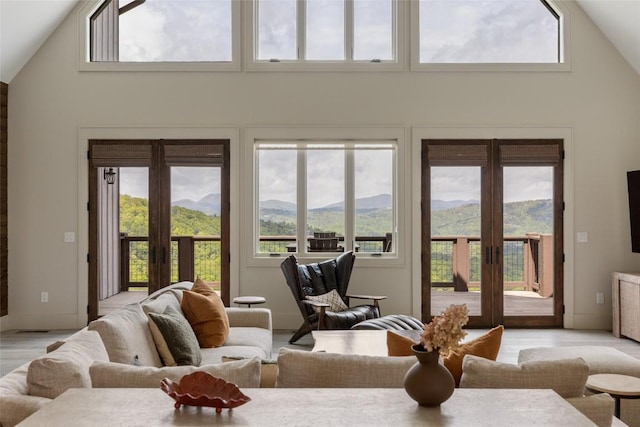 494 E Ridge Rd, Cashiers, NC 28717 - living room featuring high vaulted ceiling, french doors, and light wood finished floors