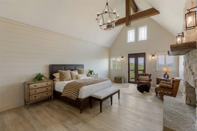 494 E Ridge Rd, Cashiers, NC 28717 - bedroom featuring high vaulted ceiling, a chandelier, access to outside, beam ceiling, and light wood-style floors