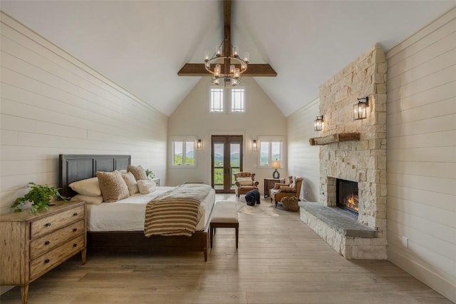 494 E Ridge Rd, Cashiers, NC 28717 - bedroom featuring high vaulted ceiling, access to exterior, a fireplace, a chandelier, and beam ceiling
