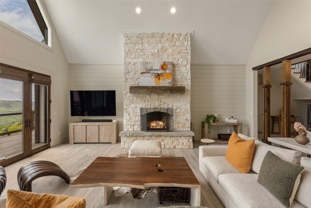 494 E Ridge Rd, Cashiers, NC 28717 - living room with high vaulted ceiling, light wood-style floors, a fireplace, and stairway