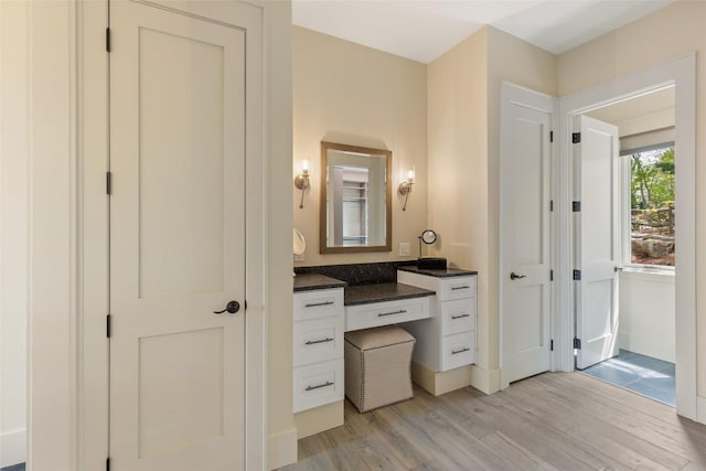 494 E Ridge Rd, Cashiers, NC 28717 - bathroom featuring wood finished floors, vanity, and baseboards