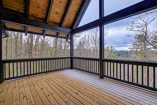 unfurnished sunroom with lofted ceiling with beams and wood ceiling