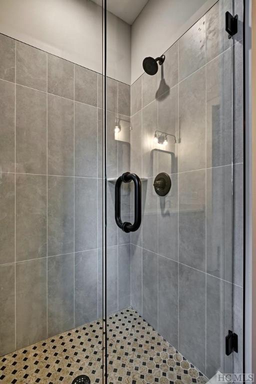 bathroom with an enclosed shower