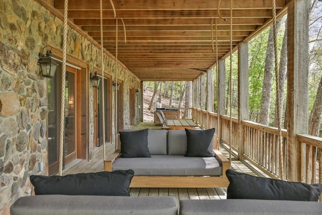 sunroom / solarium featuring outdoor lounge area