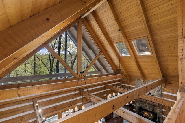 attic with an upstairs landing and a skylight