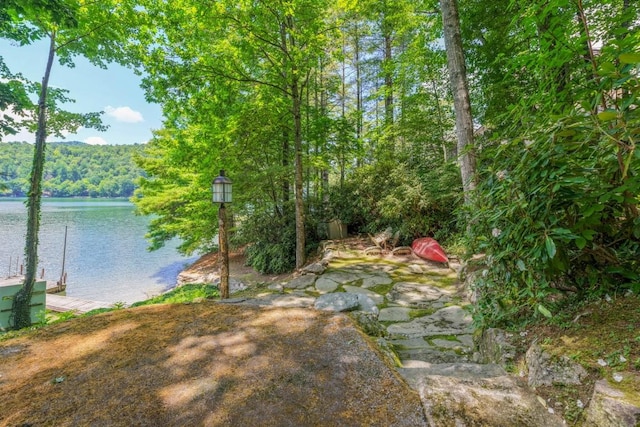 268 Tocami Trl, Cullowhee, NC 28723 - view of yard featuring a water view, a view of trees, and a dock