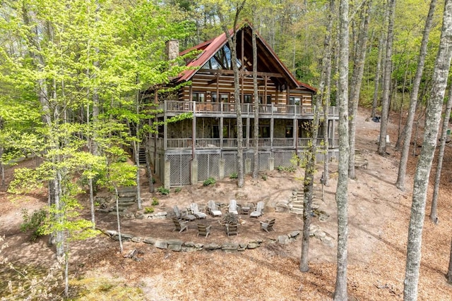 view of outdoor structure featuring a wooded view