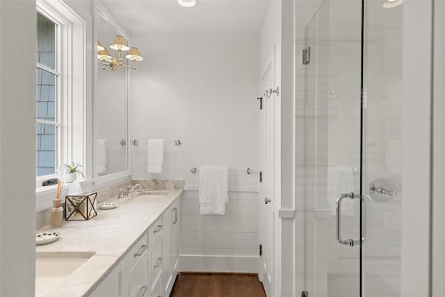 893 High Mountain Dr, Cashiers, NC 28717 - full bath featuring double vanity, a stall shower, wood finished floors, and a chandelier