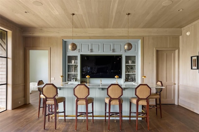 893 High Mountain Dr, Cashiers, NC 28717 - kitchen featuring wooden ceiling, dark wood-style flooring, decorative light fixtures, a kitchen breakfast bar, and wooden walls