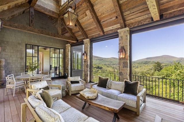 893 High Mountain Dr, Cashiers, NC 28717 - wooden terrace with outdoor lounge area, a mountain view, a view of trees, and outdoor dining area