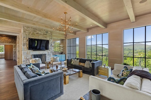 893 High Mountain Dr, Cashiers, NC 28717 - living room with wood finished floors, a stone fireplace, a chandelier, and wooden ceiling with exposed beams