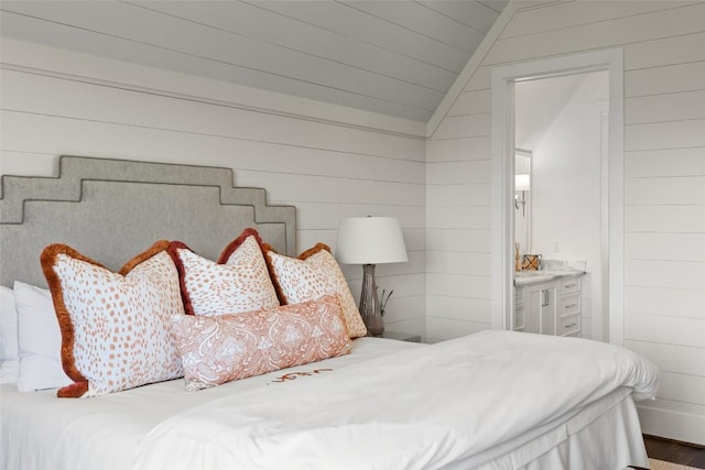 893 High Mountain Dr, Cashiers, NC 28717 - bedroom with lofted ceiling, wood walls, wood finished floors, and connected bathroom