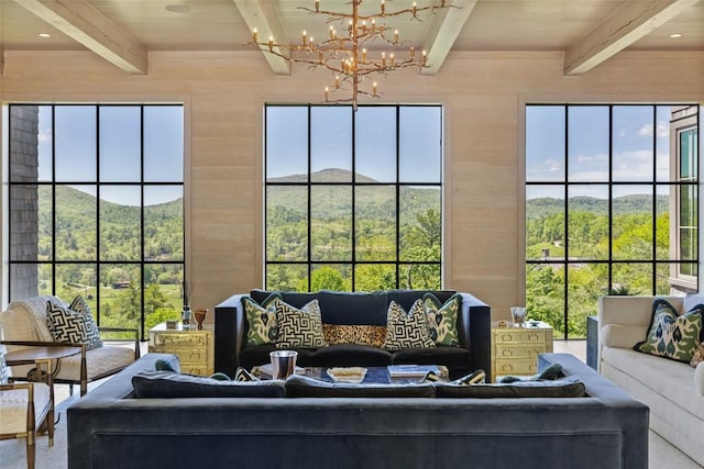 893 High Mountain Dr, Cashiers, NC 28717 - living room featuring beamed ceiling, a chandelier, wooden walls, and a mountain view