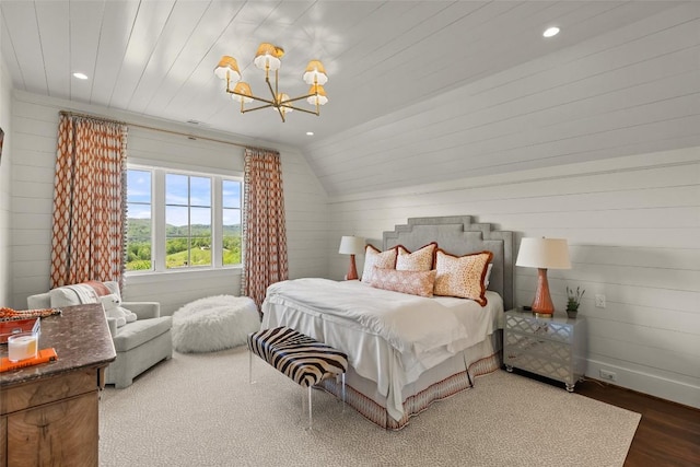 893 High Mountain Dr, Cashiers, NC 28717 - bedroom featuring a chandelier, wood finished floors, lofted ceiling, recessed lighting, and wooden walls
