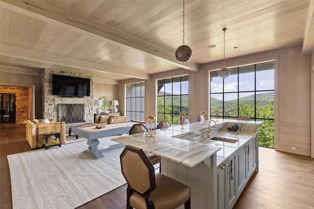 893 High Mountain Dr, Cashiers, NC 28717 - dining area featuring wood ceiling with exposed beams, wood finished floors, healthy amount of natural light, a fireplace, and billiards