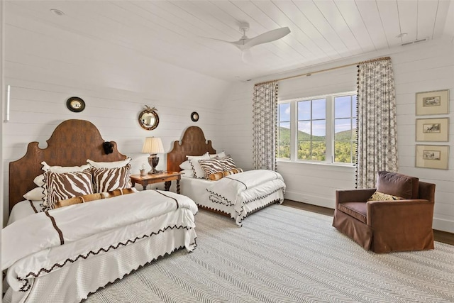 893 High Mountain Dr, Cashiers, NC 28717 - bedroom with lofted ceiling, wood finished floors, and ceiling fan