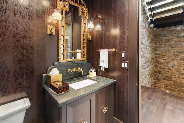 893 High Mountain Dr, Cashiers, NC 28717 - bathroom with toilet, vanity, and wood finished floors