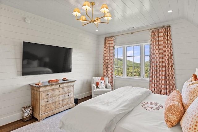 893 High Mountain Dr, Cashiers, NC 28717 - bedroom with a chandelier, wooden walls, and recessed lighting