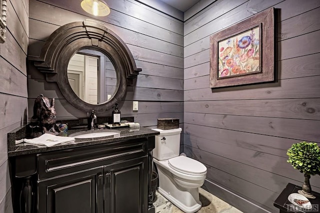 bathroom with toilet and wooden walls